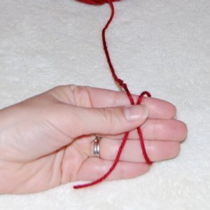 Magic Ring Crochet Step 2: Hold the place where the yarn overlaps between your thumb and forefinger