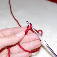 Step 4: Bring through a loop of the working yarn, one loop is now on the hook