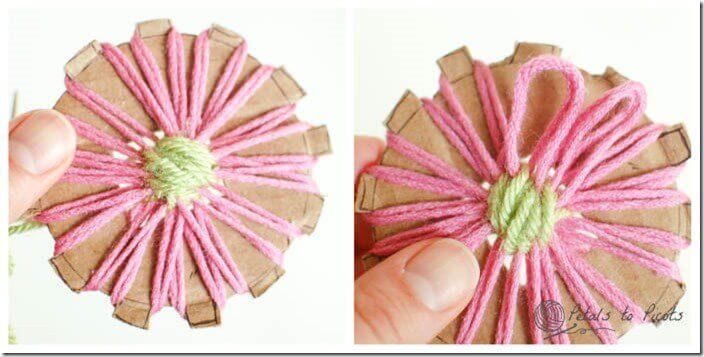 Step 5 - Secure yarn at the back of your flower and gently pull loops off loom.