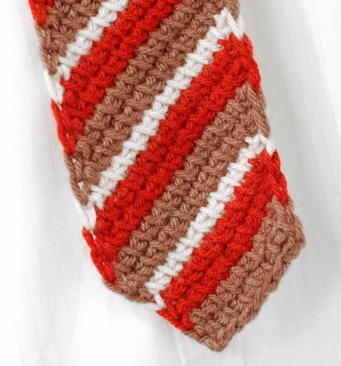 Striped Tunisian crochet necktie handmade with brown, rust, and cream yarn