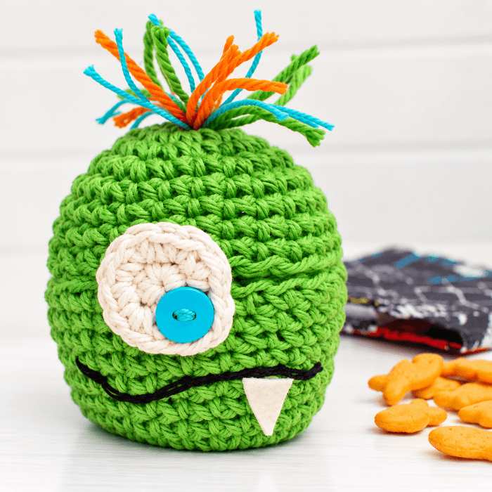 One-eyed green monster crochet apple cozy