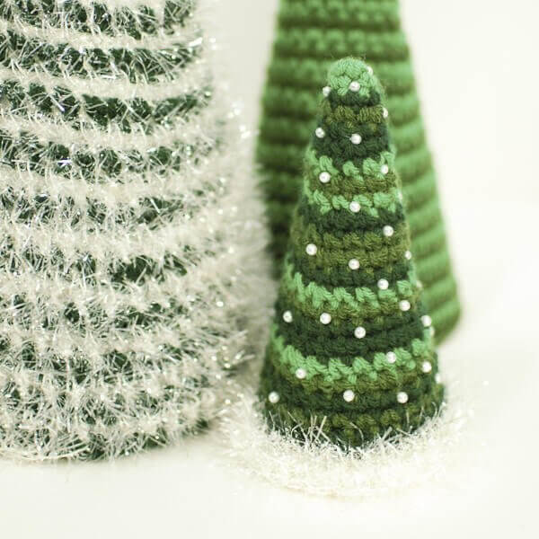 Crochet up three sizes of Christmas Tree Patterns for a beautiful centerpiece.