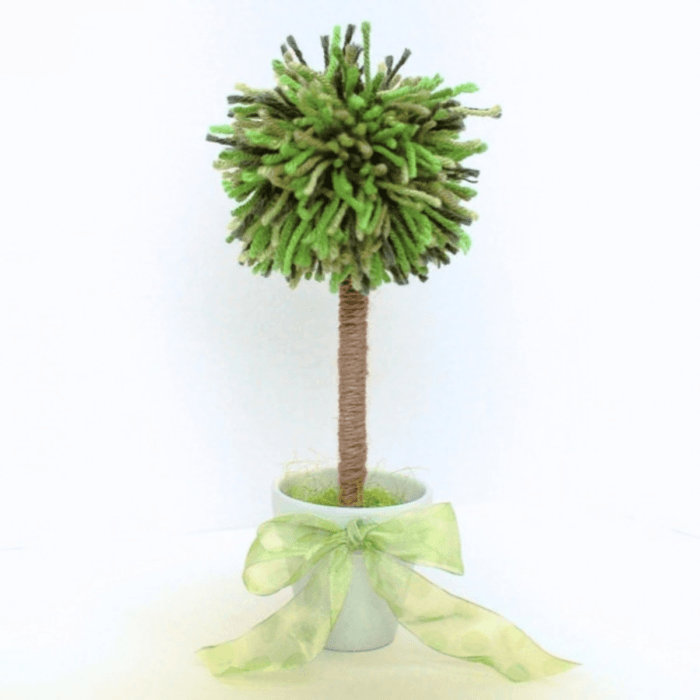 Colorful handmade yarn pom-pom topiary in a flower pot