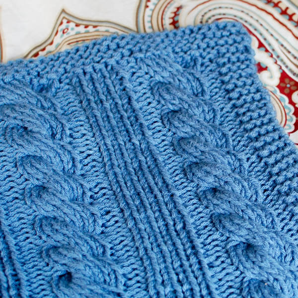 Cables and Columns Knit Blanket Pattern | www.petalstopicots.com | #knit #afghan #cable #blanket