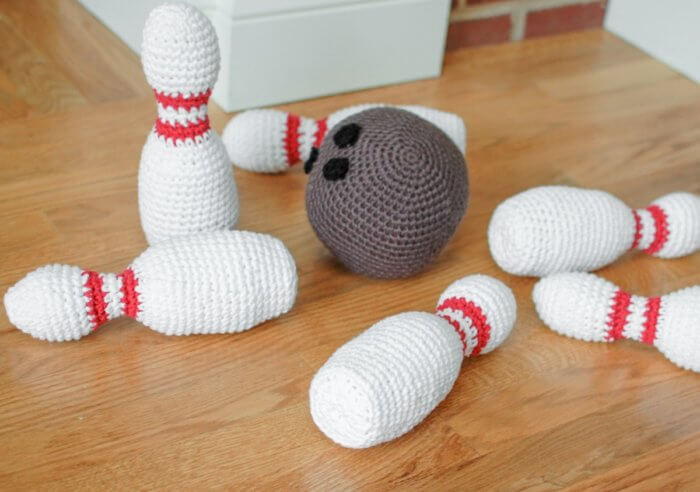 Little ones will love knocking down these crocheted bowling pins!