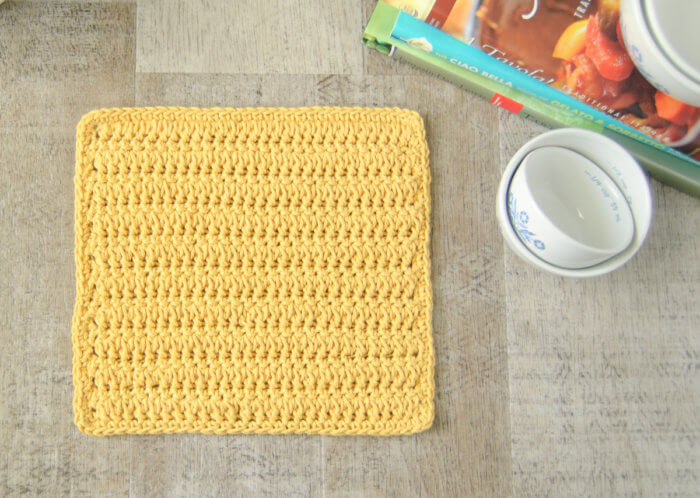 This forked cluster stitch crochet dishcloth pattern creates a beautifully textured and reversible design.