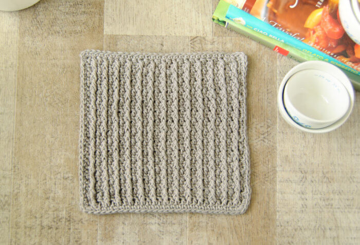 The Cabled Columns dishcloth features deeply textured accent columns produced by alternating crochet post stitches with regular stitches.