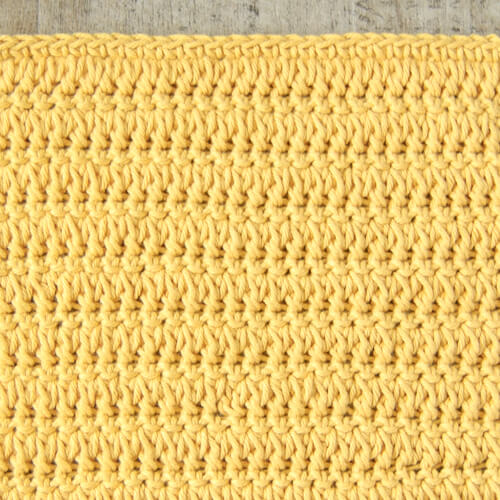 Rows of forked cluster stitches alternated with single crochet stitches worked in the back look only.