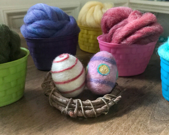 Coloring eggs has never been so fun! Use bits of colorful wool to make lovely felted Easter eggs you can enjoy in your decor for years to come. 