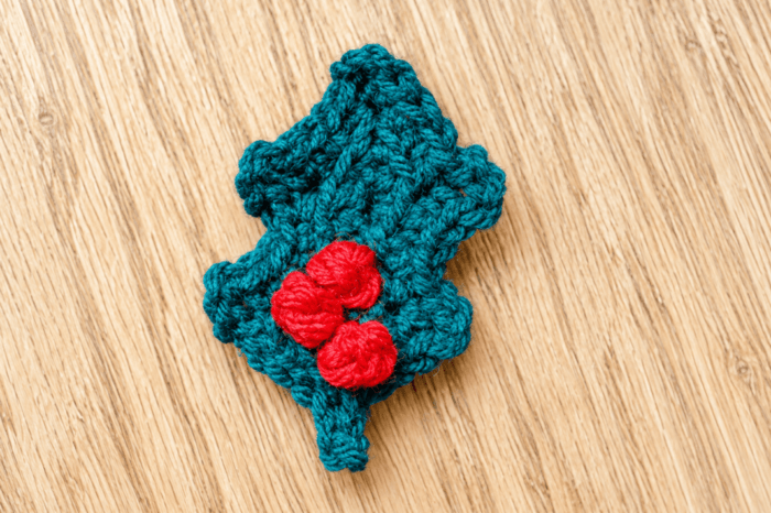 Crochet holly leaf with three berries