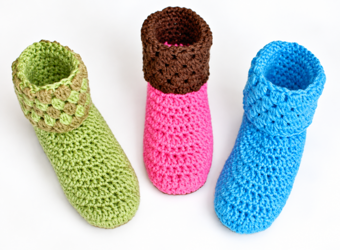 Green, pink and brown, and blue crochet bootie slippers with textured ankle cuffs